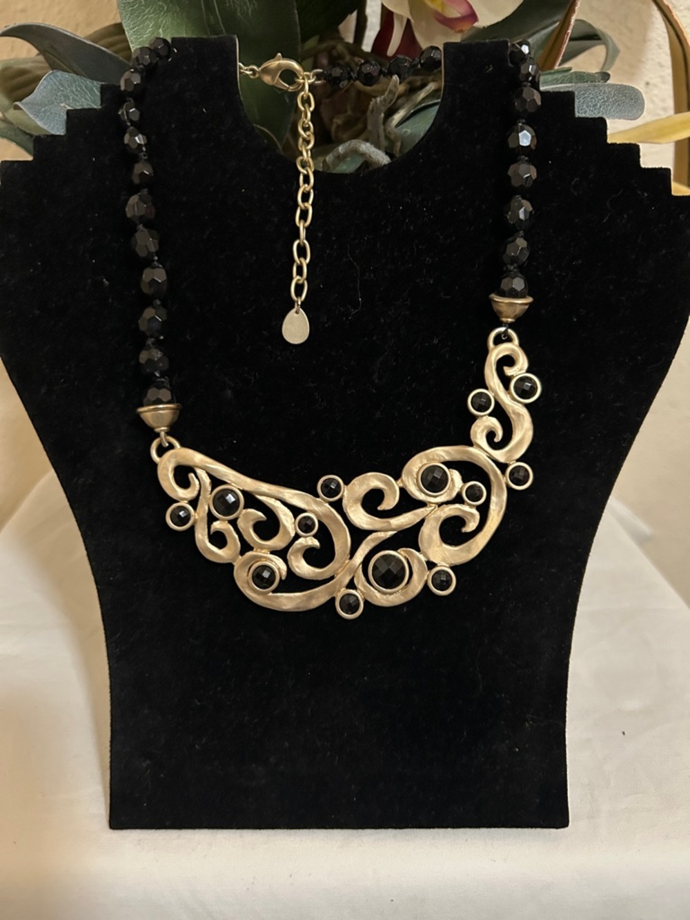 Elegant Scroll Bib Necklace with Black Beads